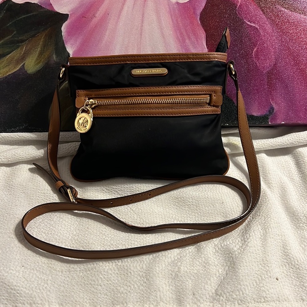 Black Crossbody Nylon Michael Kors. brown leather strap in perfect condition.